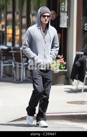 Justin Timberlake wearing a grey hoodie and sunglasses walking in SoHo New York City, USA - 11.05.09 Stock Photo