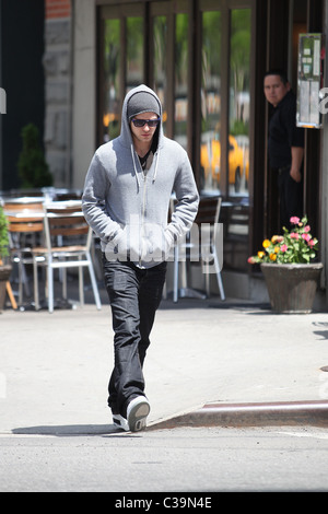 Justin Timberlake wearing a grey hoodie and sunglasses walking in SoHo New York City, USA - 11.05.09 Stock Photo