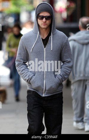 Justin Timberlake wearing a grey hoodie and sunglasses walking in SoHo New York City, USA - 11.05.09 Stock Photo