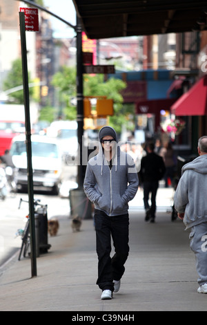 Justin Timberlake wearing a grey hoodie and sunglasses walking in SoHo New York City, USA - 11.05.09 Stock Photo