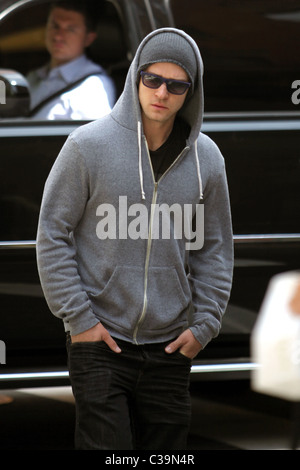 Justin Timberlake wearing a grey hoodie and sunglasses walking in SoHo New York City, USA - 11.05.09 Stock Photo