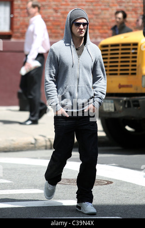 Justin Timberlake wearing a grey hoodie and sunglasses walking in SoHo New York City, USA - 11.05.09 Stock Photo