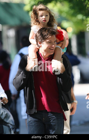 Jason Bateman carries his daughter, Francesca, on his shoulders while on break at the film set of his new movie 'The Baster' Stock Photo