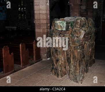 St,Mary the virgin church. Holy Island. Lindisfarne. Monks carrying St Cuthbert's body.'The journey' by Fenwick Lawson.