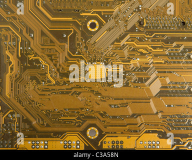 Electronic circuits on the back of the computer motherboard Stock Photo
