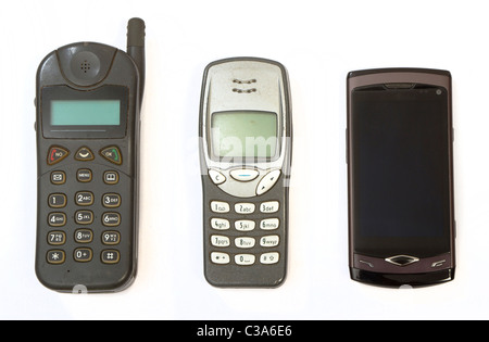 Cell phones from three different generations, very old, middle old and new smartphone Stock Photo