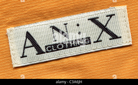 Detail of the label in the collar of a man's shirt from the An:x clothing Stock Photo