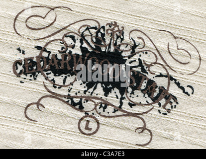 Detail of the label in the collar of a man's striped shirt from the clothing Cederwood State Stock Photo
