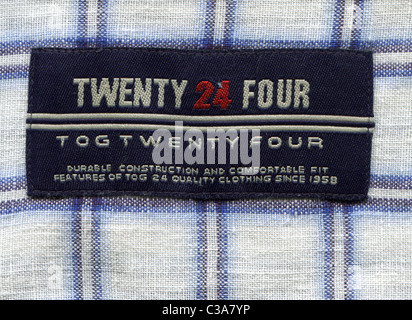 Detail of the label in the collar of a man's plaid shirt from the clothing Twenty Four Stock Photo