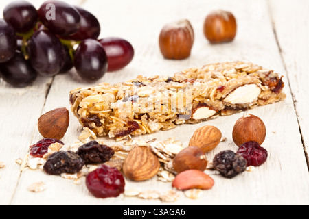 Granola cereal bar with grapes dried fruit and nuts Stock Photo