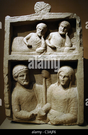 Phoenician art. Cyprus. 4th century BC. Classical Period. Grave marker depicting two men reclining at a banquet  and a couple. Stock Photo