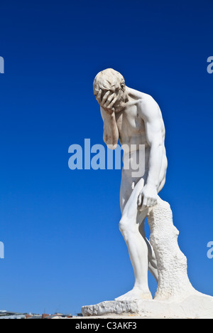 A statue of Cain after killing his brother Abel by Henri Vidal in the Tuileries Garden, Paris Stock Photo