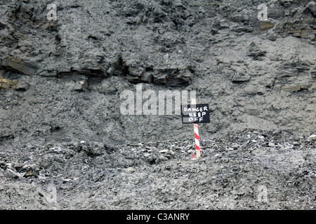 Danger keep off sign on cliffs at  Charmouth beach, Dorset, England UK Stock Photo