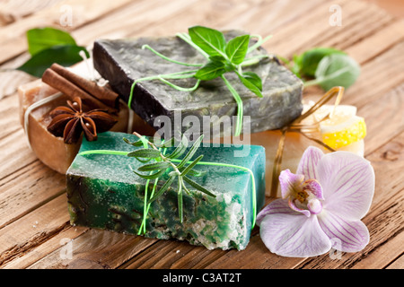 Pieces of natural soap with herbs. Stock Photo