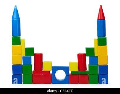 Rickety castle of colored cubes isolated on white background Stock Photo