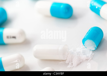 Open Pill Capsule Among Assortment Stock Photo