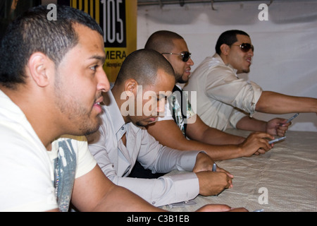 Lenny Santos, Anthony Romeo Santos, Henry Santos Jeter and Max Santos Aventura sign copies of their new CD 'The Last' at Wal Stock Photo