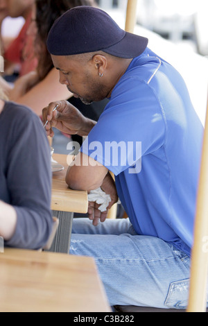Eriq La Salle eating at Toast Bakery Cafe while wearing a backwards ...