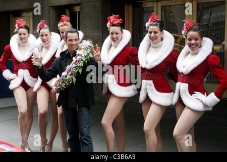 The winner of the 2009 Indianapolis 500, Helio Castroneves and the Rockettes attend the post-race victory tour at Radio City Stock Photo