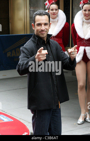 The winner of the 2009 Indianapolis 500, Helio Castroneves and the Rockettes attend the post-race victory tour at Radio City Stock Photo