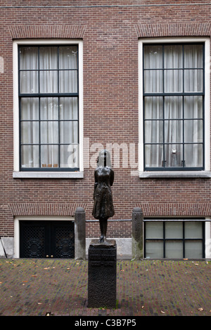 A statue of Anne Frank near Anne Frank House in Amsterdam Stock Photo