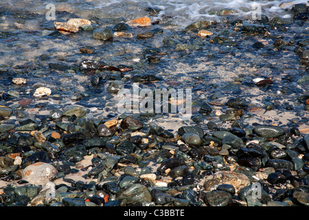 Waves washing over the pebbles on Porthmeor Beach, St Ives Cornwall UK Stock Photo