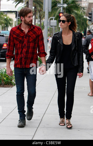 Caleb Followill of rock band Kings of Leon holds hands with a female companion after having lunch at the Petrossian restaurant Stock Photo