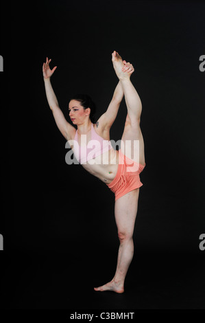 Young female modern dancer On black Background Stock Photo