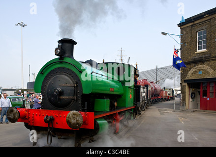 A small steam engine moving through Chatham Historic Dockyard. Stock Photo