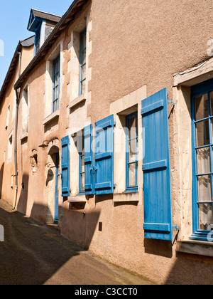 Blue painted wooden window shutters - France. Stock Photo
