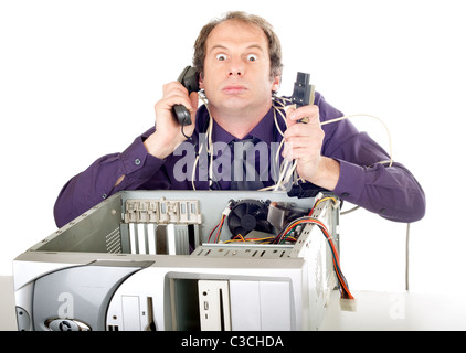 furious businessman having computer problems trying to call support Stock Photo