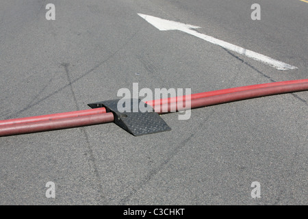 ramps put in place by firefighters to protect there hoses from traffic Stock Photo