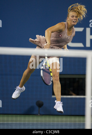 Caroline Wozniacki of Denmark in action during her first-round match at ...