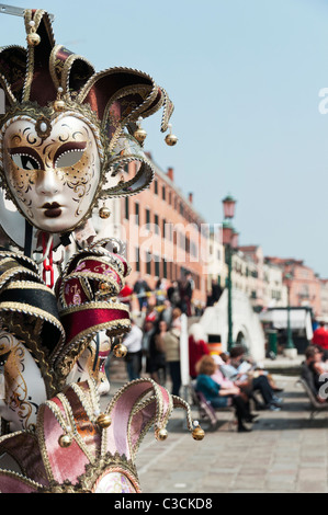 Mardi Gras masks on display near the Piazza of San Marco on Riva degli Schiavoni in Venice, Italy Stock Photo