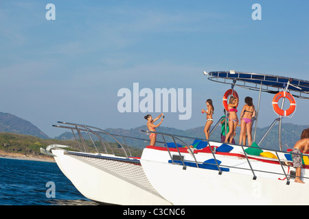 young people partying on yacht Stock Photo