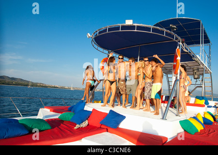 young people partying on yacht Stock Photo