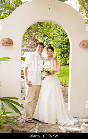 bridal couple posing outdoors Stock Photo
