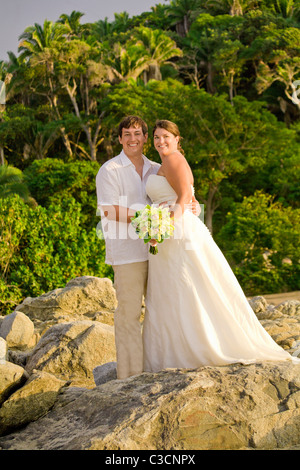 bridal couple posing outdoors Stock Photo