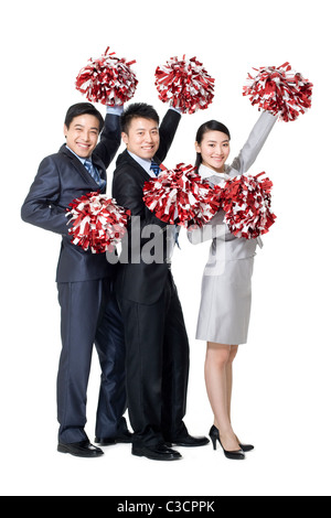 A team of businesspeople cheering with pompoms Stock Photo