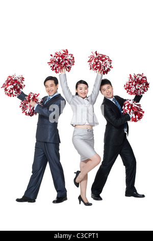 A team of businesspeople cheering with pompoms Stock Photo