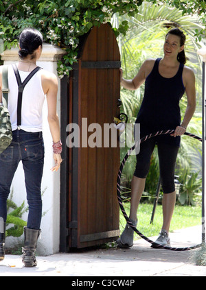 Liv Tyler waving goodbye to a friend outside her house while holding a hula hoop Los Angeles, California - 17.06.09 BJJ / Stock Photo