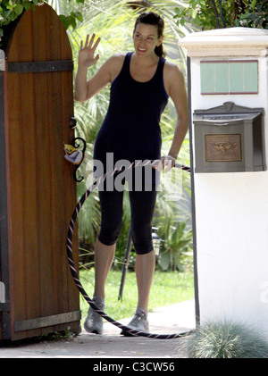 Liv Tyler waving goodbye to a friend outside her house while holding a hula hoop Los Angeles, California - 17.06.09 BJJ / Stock Photo