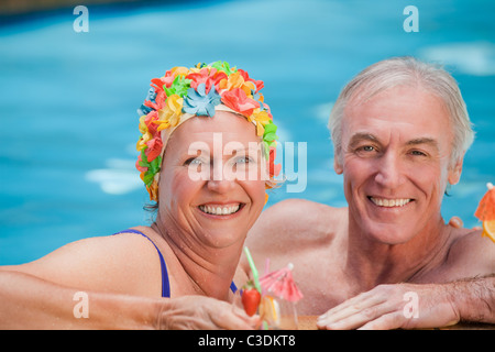 Happy mature couple in the swimming pool Stock Photo