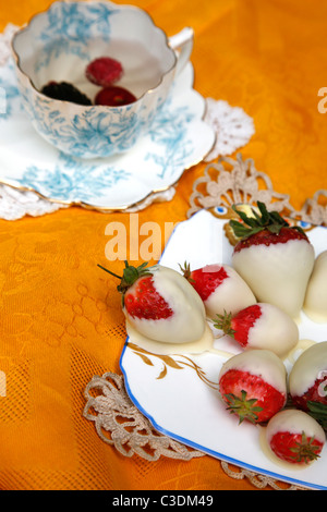 Traditional English cream tea picnic served on vintage crockery Stock Photo