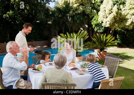 Family eating in the garden Stock Photo