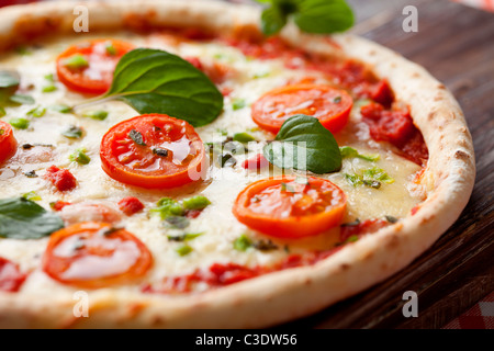 fresh italian pizza, with tomato, mozzarella and green pepper Stock Photo