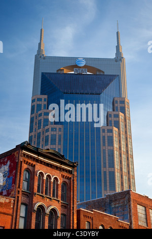 The AT&T building towers over the historic buildings and honky-tonks along lower Broadway in Nashville Tennessee USA Stock Photo