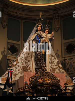 Virgin Mary holding the Infant Christ, arms outstretched, above gold altar, Side Chapel, Metropolitan Cathedral, Santiago, Chile Stock Photo