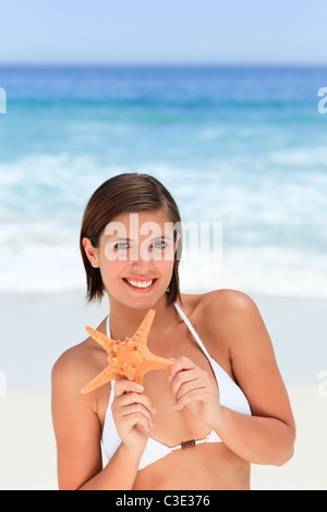 Lovely woman with a starfish Stock Photo