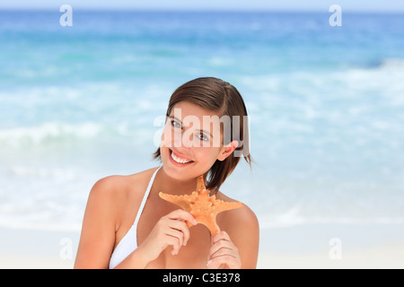 Lovely woman with a starfish Stock Photo